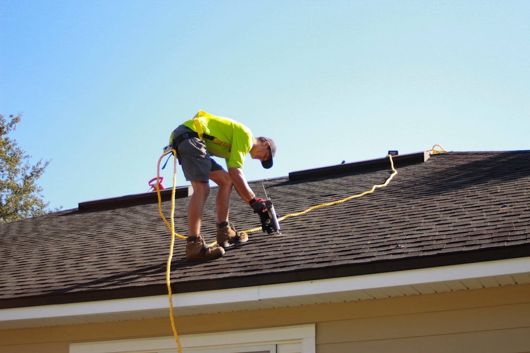 Roof professional examining a home before a Dunedin, Florida real estate purchase